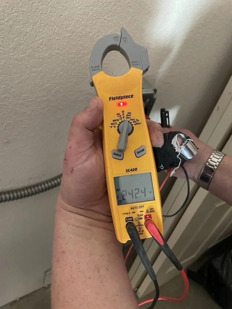 Voltage testing with clamp meter during Generator Installation in Camdenton